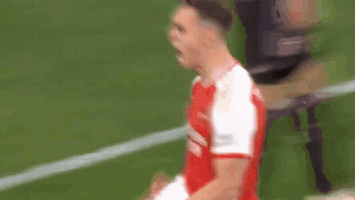 Two Soccer Players In Red And White Fighting GIF