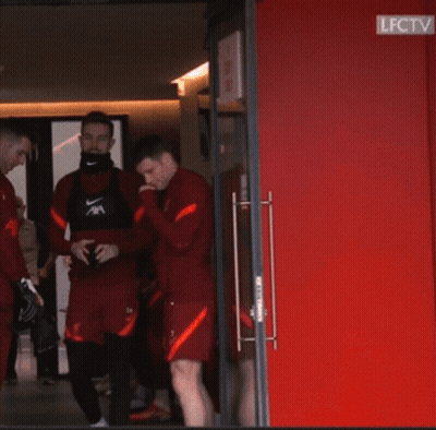Two Soccer Players In Red AXA Jerseys GIF