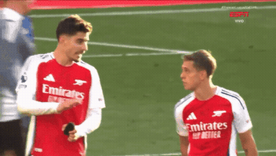 Two Soccer Players In Red Emirates Fly Better Jerseys GIF