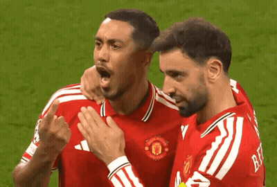 Two Soccer Players In Red Manchester Jerseys GIF