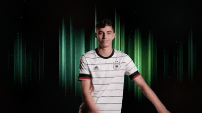 Two Soccer Players In Red Standard Chartered Jerseys GIF