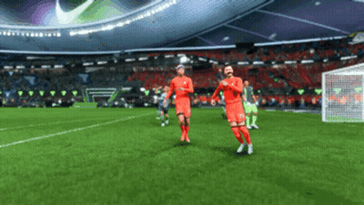 Two Soccer Players In Red Uniforms Running GIF