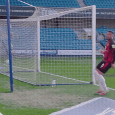 Two Soccer Players In Yellow Jerseys GIF