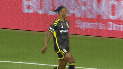 Two Soccer Players On A Field With A Lowe Sign Behind Them GIF