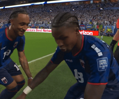 Two Soccer Players On A Field With A Sign That Says Best Network GIF