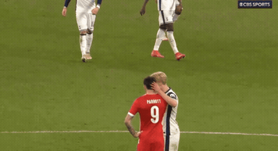 Two Soccer Players On A Field With One Wearing A Number 9 GIF