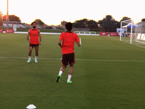 Two Soccer Players On A Field With One Wearing A Shirt That Says ' Allianz ' GIF