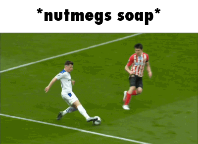 Two Soccer Players On A Field With The Words " Nutmegs Soap " Below Them GIF
