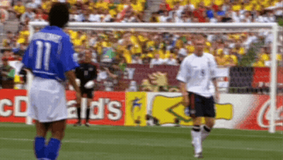 Two Soccer Players On Field With McDonald's Sign GIF