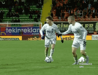 Two Soccer Players On Field With Tekinreklam Sign GIF