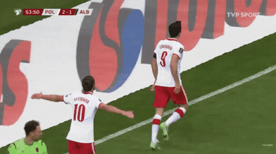 Two Soccer Players On Field With TVP Sport Banner GIF