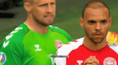 Two Soccer Players One In A Green Jersey And One In A Red Jersey GIF