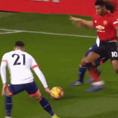 Two Soccer Players One Of Whom Has The Number 21 On Their Jersey GIF