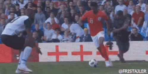 Two Soccer Players Playing On Field With Crowd GIF