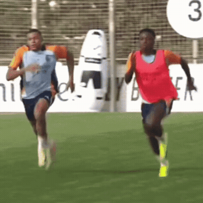 Two Soccer Players Running On A Field With The Number 3 Behind Them GIF
