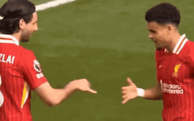 Two Soccer Players Shaking Hands On Field GIF