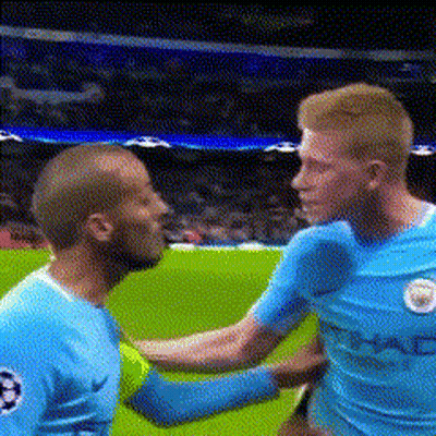 Two Soccer Players Shaking Hands On Field GIF