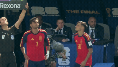 Two Soccer Players Stand In Front Of A Fifa World Cup Sign GIF