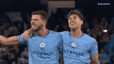 Two Soccer Players Standing Next To Each Other GIF