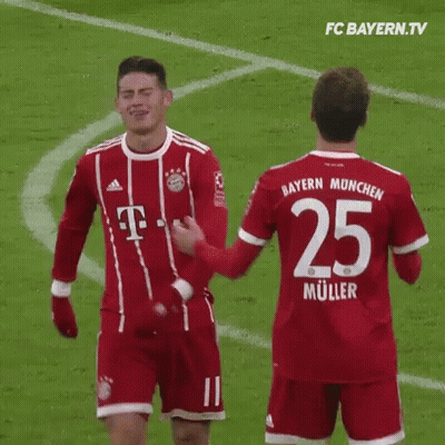 Two Soccer Players Standing Together GIF