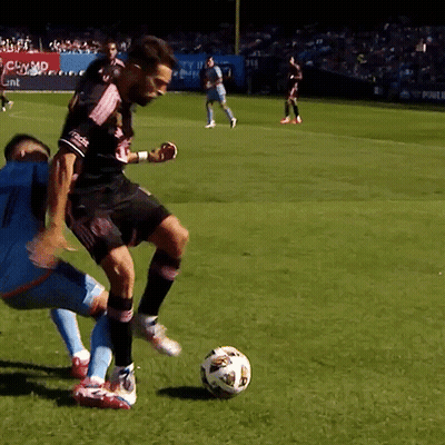 Two Soccer Players Under CBS Banner GIF
