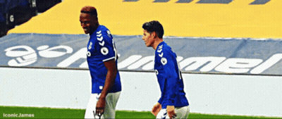 Two Soccer Players Walking On Field With Iconic James GIF