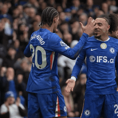 Two Soccer Players Wearing Blue Jerseys With Ifs.co On Them GIF