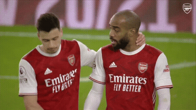 Two Soccer Players Wearing Emirates Fly Better Jerseys Are Hugging GIF