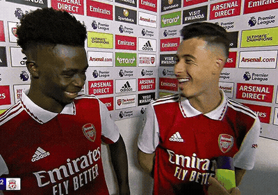 Two Soccer Players Wearing Emirates Fly Better Jerseys Are Talking To Each Other GIF