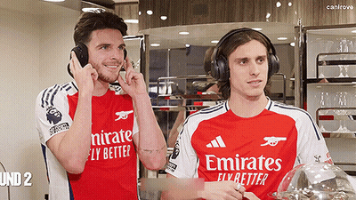 Two Soccer Players Wearing Emirates Shirts GIF