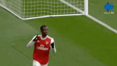 Two Soccer Players Wearing Fly Emirates Jerseys Celebrate GIF