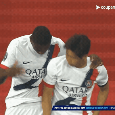 Two Soccer Players Wearing Qatar Airways Jerseys On A Red Field GIF