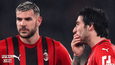 Two Soccer Players Wearing Red And Black Striped Shirts With Karim Written On Them GIF