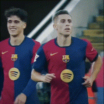 Two Soccer Players Wearing Red And Blue Jerseys With Spotify Logos On Them GIF