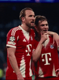 Two Soccer Players Wearing Red T-Mobile Jerseys Are Hugging GIF