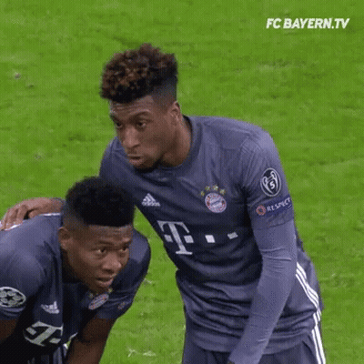 Two Soccer Players Wearing T-Mobile Jerseys Are On The Field GIF