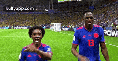Two Soccer Players With Number 13 Jersey GIF