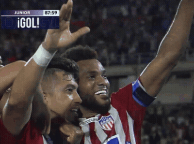 Two Soccer Players With Olympica On Their Shirts Are Celebrating A Goal GIF