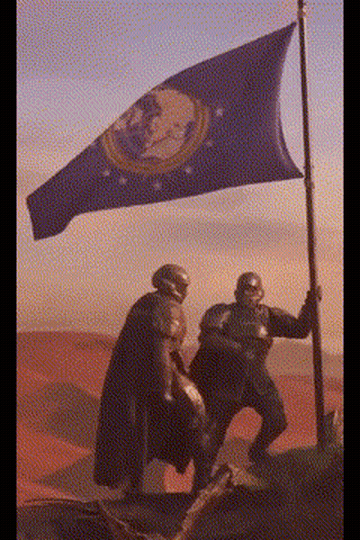 Two Soldiers Are Holding A Flag In A Desert GIF