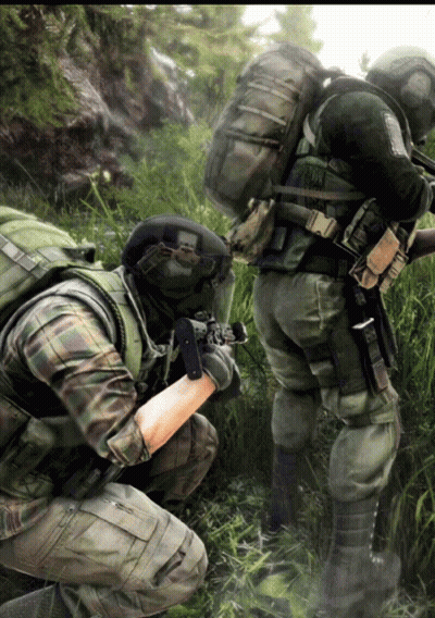 two soldiers are kneeling down in the grass and one has a backpack that says us army