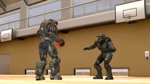Two Soldiers Are Playing Basketball In A Gym And One Of Them Is Holding A Basketball . GIF
