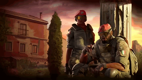 Two Soldiers Are Standing In Front Of A Building With One Wearing A Red Beret With The Letter C On It GIF