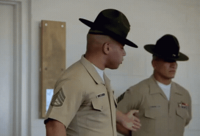 Two Soldiers Are Standing Next To Each Other And One Has A Name Tag That Says ' Smith ' On It GIF