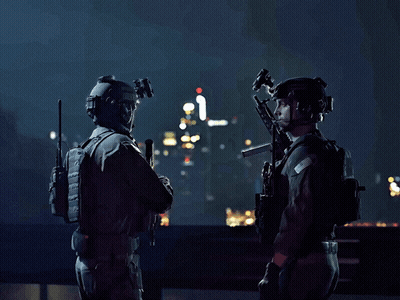 Two Soldiers Are Standing Next To Each Other With Guns In Their Hands GIF