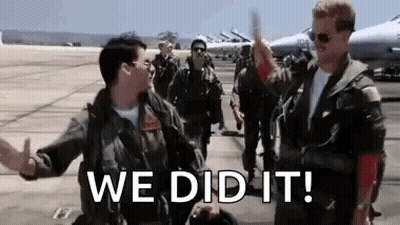 Two Soldiers High-Fiving On Runway GIF