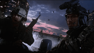 Two Soldiers Standing By Bridge At Night GIF