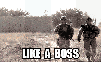Two Soldiers Walking In A Field With The Words Like A Boss On The Bottom GIF