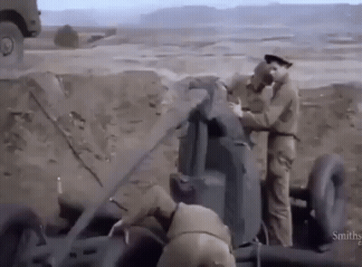 Two Soldiers Working On Cannon GIF