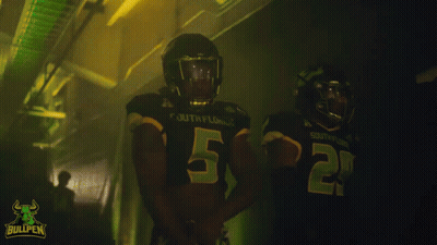 Two South Florida Football Players in Dark Locker Room