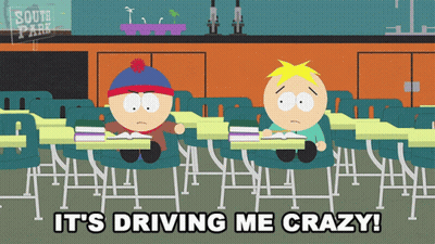Two South Park Characters Are Sitting At Desks In A Classroom GIF